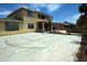 Spacious concrete backyard basketball court and view of an outdoor pool area at 6619 W Cordia Ln, Phoenix, AZ 85083