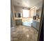 Bathroom featuring a soaking tub, dual vanities, and tiled flooring for a clean and elegant design at 6619 W Cordia Ln, Phoenix, AZ 85083