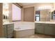 Bathroom features a soaking tub, double sinks, and lots of natural light to make this a relaxing space at 6619 W Cordia Ln, Phoenix, AZ 85083