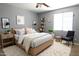 Stylishly furnished bedroom with a ceiling fan, soft lighting, and a cozy rug at 6619 W Cordia Ln, Phoenix, AZ 85083