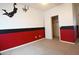 A carpeted bedroom features fun basketball-themed wall decor and a closet at 6619 W Cordia Ln, Phoenix, AZ 85083