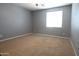 Bedroom with neutral color and large window at 6619 W Cordia Ln, Phoenix, AZ 85083