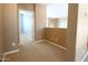 A carpeted hallway features access to other rooms in the home at 6619 W Cordia Ln, Phoenix, AZ 85083