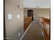 Upstairs hallway featuring railing to overlook below at 6619 W Cordia Ln, Phoenix, AZ 85083