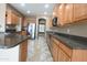 Well-equipped kitchen with granite countertops, stainless steel appliances, and light wood cabinetry at 6619 W Cordia Ln, Phoenix, AZ 85083