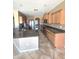 Kitchen featuring granite countertops, stainless steel appliances, and wood cabinets for a modern design at 6619 W Cordia Ln, Phoenix, AZ 85083