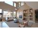 Bright living room with ample natural light, a fireplace, and a neutral color scheme at 6619 W Cordia Ln, Phoenix, AZ 85083