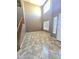 Bright and open living room featuring tile flooring, tall ceilings, and natural light at 6619 W Cordia Ln, Phoenix, AZ 85083