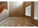 Neutral living room with tall ceilings and tile floor at 6619 W Cordia Ln, Phoenix, AZ 85083