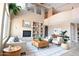 Airy living room with high ceilings, fireplace, and balcony overlook create a grand gathering space at 6619 W Cordia Ln, Phoenix, AZ 85083
