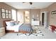 Comfortable bedroom with natural light, neutral decor, and a cozy bed for relaxing and resting at 6619 W Cordia Ln, Phoenix, AZ 85083