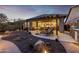 Stunning backyard with covered patio and desert landscape, seamlessly blending indoor and outdoor spaces at 6929 E Quill St, Mesa, AZ 85207