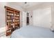 This bedroom boasts a large bookcase and closet, offering ample storage and style at 6929 E Quill St, Mesa, AZ 85207