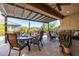 Inviting covered patio with comfortable seating and dining area, perfect for outdoor entertaining at 6929 E Quill St, Mesa, AZ 85207