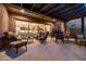 Relaxing covered patio with comfortable seating and seamless indoor/outdoor living space at 6929 E Quill St, Mesa, AZ 85207