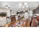 Open concept design showcasing dining room seamlessly connecting to the cozy living space at 6929 E Quill St, Mesa, AZ 85207