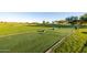 View of the well-manicured golf course with lush green grass and surrounding desert landscape at 6929 E Quill St, Mesa, AZ 85207