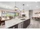 Modern kitchen with granite countertops, stainless steel appliances, and an open layout at 6929 E Quill St, Mesa, AZ 85207