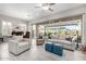 Bright living room boasts lots of natural light, neutral tones, and comfortable seating arrangements at 6929 E Quill St, Mesa, AZ 85207
