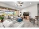 Cozy living room features a large TV and comfortable seating, perfect for relaxation and entertainment at 6929 E Quill St, Mesa, AZ 85207