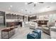 Inviting living space boasts an open layout with a modern kitchen, dining area, and comfortable seating at 6929 E Quill St, Mesa, AZ 85207