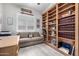 Inviting office space with custom built-in bookshelves, sofa and natural light at 6929 E Quill St, Mesa, AZ 85207