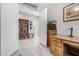 Bright home office with wooden desk, bookcase and decoratively displayed artwork adding charm at 6929 E Quill St, Mesa, AZ 85207