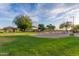 Community playground with swings, slides, and play structures, perfect for outdoor fun and recreation at 6929 E Quill St, Mesa, AZ 85207