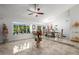 Formal dining area with large windows and elegant decor and beautiful tile floors at 6941 W Voltaire Ave, Peoria, AZ 85381