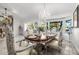 Formal dining room with ornate table, chairs, and a crystal chandelier creates an elegant setting for dining at 6941 W Voltaire Ave, Peoria, AZ 85381