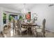 Elegant dining room featuring a chandelier and large window views at 6941 W Voltaire Ave, Peoria, AZ 85381