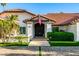 Charming home featuring lush landscaping, an American flag and a beautifully tiled roof at 6941 W Voltaire Ave, Peoria, AZ 85381