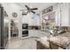 Modern kitchen featuring stainless steel appliances and granite countertops, blending functionality and style at 6941 W Voltaire Ave, Peoria, AZ 85381