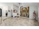 Bright living space with high ceilings, decorative artwork, and tile flooring at 6941 W Voltaire Ave, Peoria, AZ 85381
