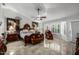 Spacious main bedroom featuring a detailed ceiling, tiled floors, bay window, and an ornate bed at 6941 W Voltaire Ave, Peoria, AZ 85381