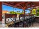 Outdoor bar with stylish seating perfect for entertaining guests in a backyard setting at 6941 W Voltaire Ave, Peoria, AZ 85381