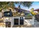 Outdoor kitchen with a grill and storage, perfect for outdoor cooking and entertaining in the backyard at 6941 W Voltaire Ave, Peoria, AZ 85381