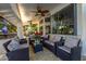 Comfortable outdoor seating area featuring plush cushions and a glass-top table for lounging and entertaining at 6941 W Voltaire Ave, Peoria, AZ 85381