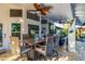 Inviting covered patio with stylish seating, ceiling fans, and decorative accents for relaxed outdoor living at 6941 W Voltaire Ave, Peoria, AZ 85381
