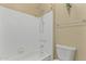 Clean bathroom featuring tiled shower and tub combination, neutral walls, and simple decor at 750 E Northern Ave # 2045, Phoenix, AZ 85020