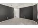 Neutral bedroom featuring dark accent walls and carpet and open closet at 750 E Northern Ave # 2045, Phoenix, AZ 85020