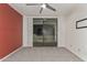 Carpeted bedroom with ceiling fan and sliding glass doors leading to outside area at 750 E Northern Ave # 2045, Phoenix, AZ 85020