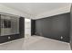 Bedroom featuring dark accent wall, window with blinds and entry to closet at 750 E Northern Ave # 2045, Phoenix, AZ 85020