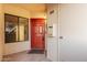 Inviting condo front door with red paint, dark hardware, and covered porch at 750 E Northern Ave # 2045, Phoenix, AZ 85020