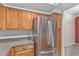 A kitchen area with stainless steel appliances and wood cabinets at 750 E Northern Ave # 2045, Phoenix, AZ 85020