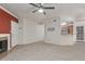 Spacious living room with neutral carpet, fireplace, and open layout at 750 E Northern Ave # 2045, Phoenix, AZ 85020
