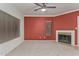 Bright living room with neutral carpet, ceiling fan, and fireplace at 750 E Northern Ave # 2045, Phoenix, AZ 85020