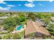 Aerial view of the property showcasing the backyard pool, landscaping, and tile roof at 7734 E Monica Dr, Scottsdale, AZ 85255