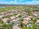 Scenic aerial view showcases homes with pools and landscaping in a well-maintained community near a golf course at 7734 E Monica Dr, Scottsdale, AZ 85255