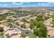 Scenic aerial view of a golf course community featuring mature landscaping, a greenbelt, and well-maintained streets at 7734 E Monica Dr, Scottsdale, AZ 85255